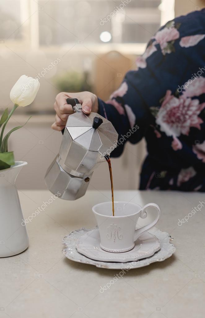 Female Hand Pouring Coffee In A Cup Stock Photo Female Hand Pouring Coffee In A Cup Stock Photo