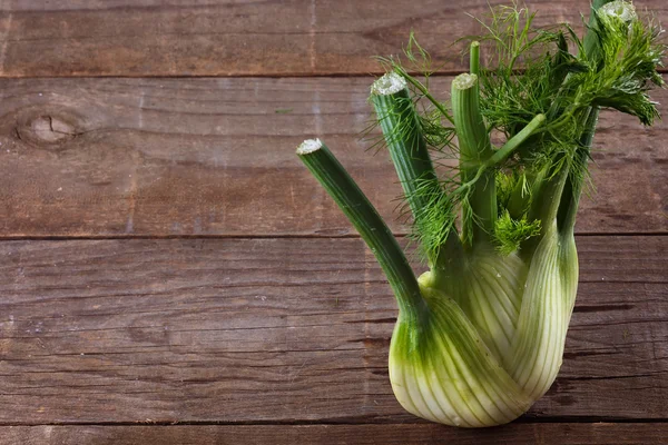 Fennel bulb on rustic wooden background — Stock Photo, Image