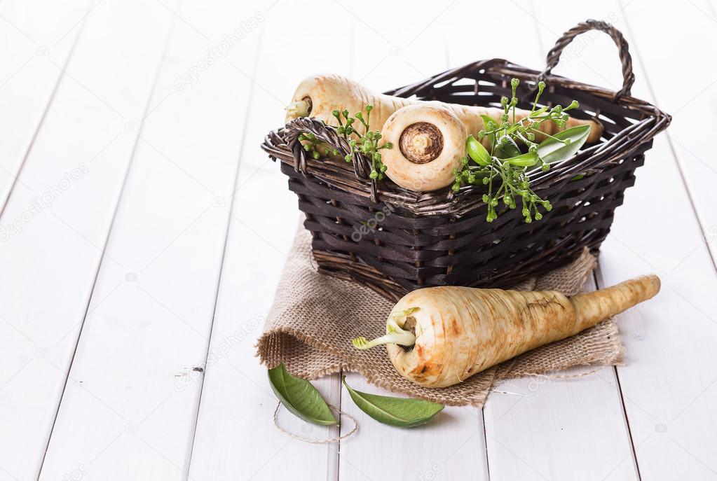 Group of parsnips in a woven basket