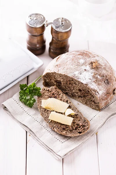 Freshly baked rye bread cob over white wooden background — Stock Photo, Image