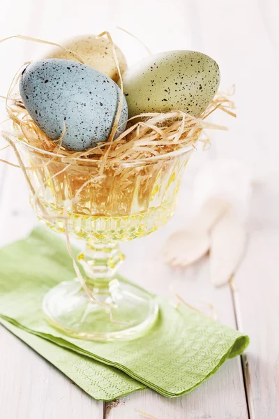 Pastel colored Easter eggs in a glass bowl — Stock Photo, Image