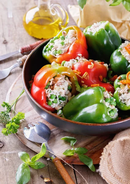 Stuffed bell peppers on rustic wooden background — Stock Photo, Image