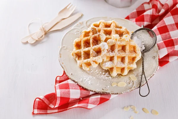 Homemade waffles over white wooden background — Stock Photo, Image