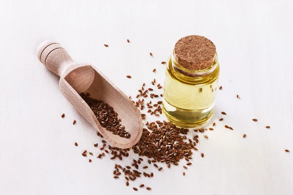 Linseed and flaxseed oil over white background — Stock Photo, Image