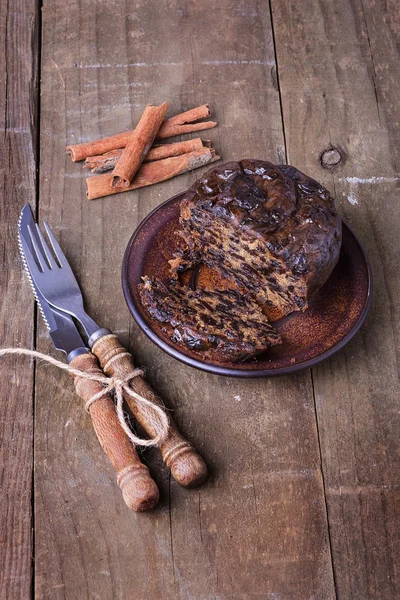 Christmas fruit cake over rustic wooden background — Stock Photo, Image