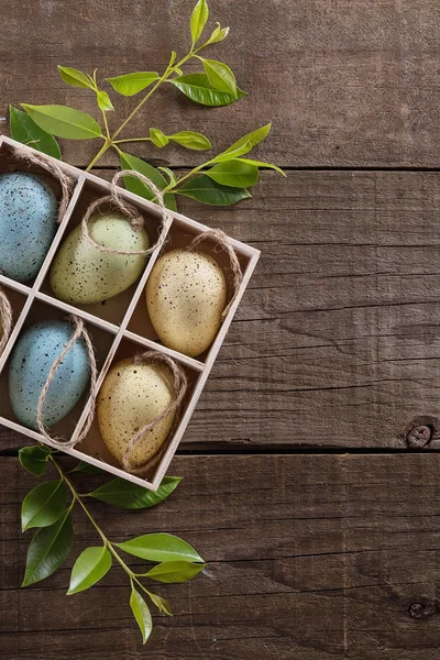 Decor Easter eggs over rustic wooden background with copyspace — Stock Photo, Image
