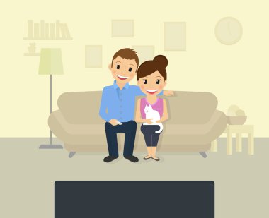 Evde televizyon izliyorum.