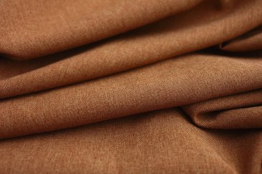 Kahverengi-sarı taç takım elbise kumaşı. Tekstil arkaplanı.