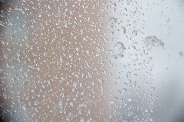 Snow drop texture on a glass window. — Stock Photo, Image