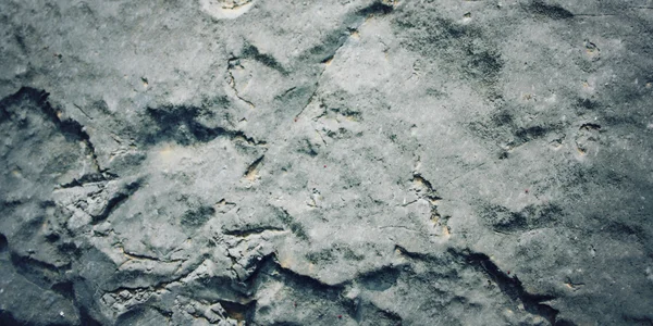 La textura áspera rocosa - la foto tonificada. Fondo de piedra . —  Fotos de Stock