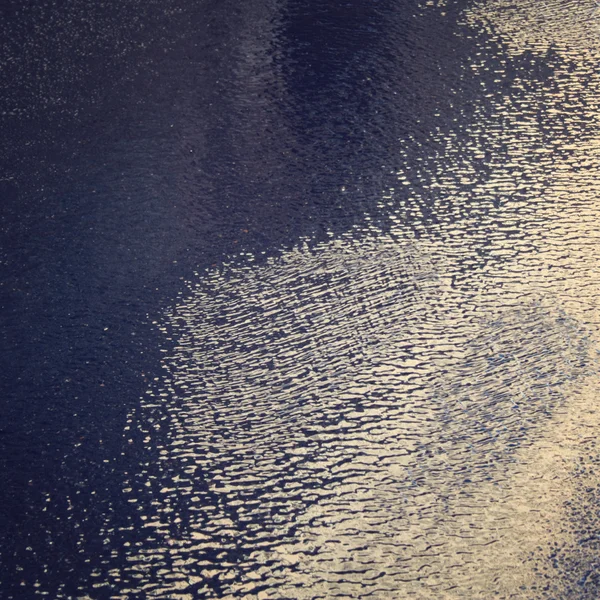 Wave pattern on the asphalt after the rain. Aged photo. — Stock Photo, Image