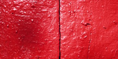 Beton duvar kırmızı boyalı. Zemin için yakın çekim.
