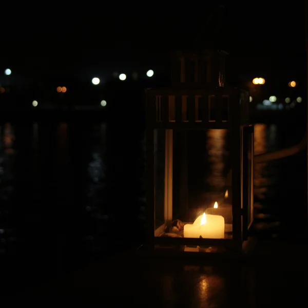 Lantern with burning candle. Aged photo. — Stock Photo, Image