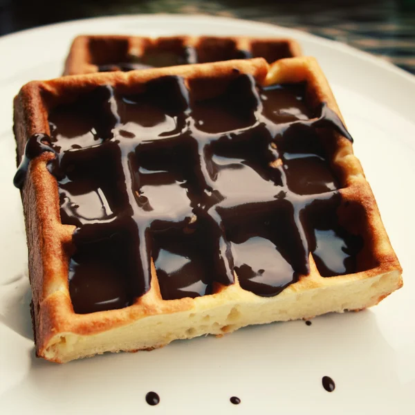 Chocolate covered Vienna Waffles on the plate. — Stock Photo, Image