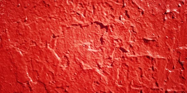 Betonwand rot gestrichen. Nahaufnahme für die Kulisse. — Stockfoto