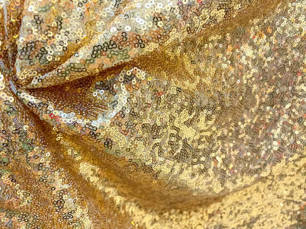 金色のスパンコール生地の質感 光沢のある金色の輝くスパンコールの背景 お祭り カーニバルやファッションの背景の概念 豪華なテキスタイルデザイン テキストのコピースペース — ストック写真