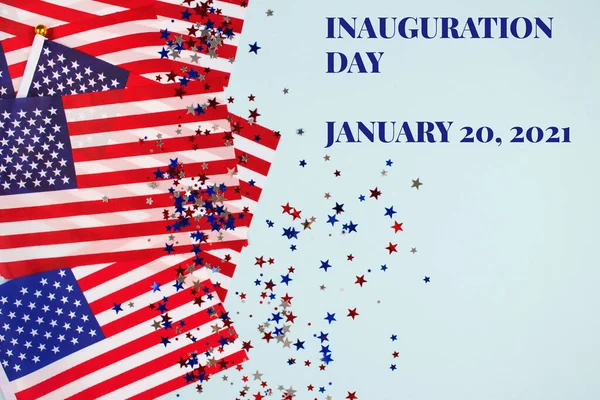 Creative composition with USA flags on bluel background, copyspace for text - Inauguration Day 2021 concept