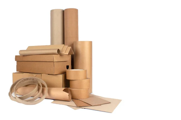 Set of different cardboard boxes, rolls of paper, paper edge protectors and tubes, sheets of paper and cardboard isolated for your presentation, catalogue or website. Sustainable packaging concept —  Fotos de Stock