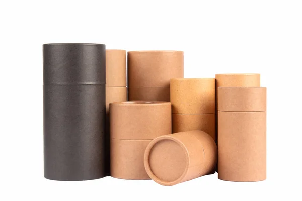 Different black and brown paper tubes with paper cap or lids, cardboard containers for packaging isolated on white background with copy space, mockup. Natural cosmetic paper packaging — Stok fotoğraf