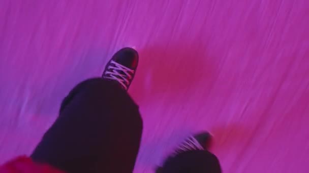 The guy is skating on an ice rink. Close-up of legs from above. POV - point of view. — Stock Video