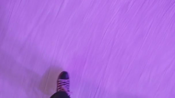 The guy is skating on an ice rink. Close-up of legs from above. POV - point of view. — Stock Video