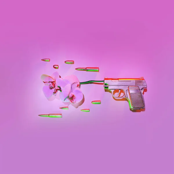 The golden gun shoots an orchid flower, next to fly bullets on a pink background, the concept against the war.