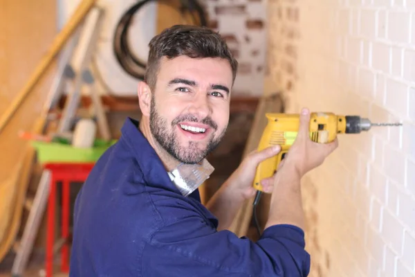 Portrait Handsome Young Repairman Drilling Wall His Workshop — Stock Fotó