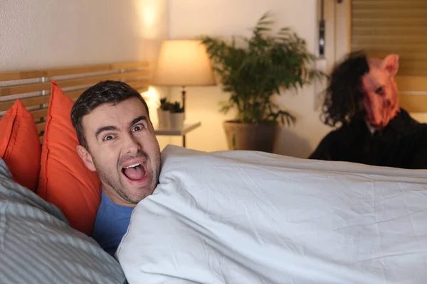 Handsome Young Man Lying Bed Home While Maniac Horror Mask — Stock Photo, Image