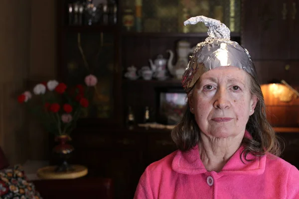 Close Portrait Mature Woman Aluminum Foil Hat Home — Stockfoto