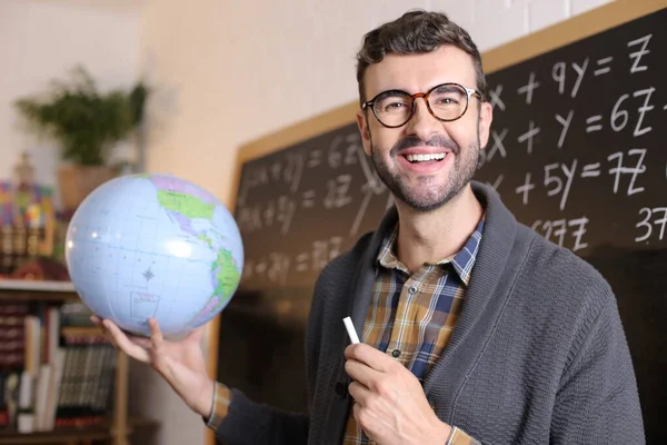 Close Portrait Handsome Young Teacher Holding Geographical Globe Front Blackboard — Stock Photo, Image