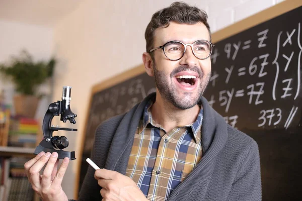 Close Portrait Handsome Young Teacher Holding Microscope Front Blackboard Classroom — Stock Photo, Image
