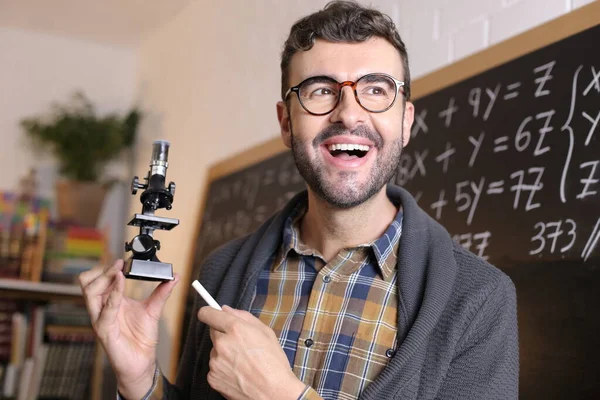 Close Portrait Handsome Young Teacher Holding Microscope Front Blackboard Classroom — Stock Photo, Image