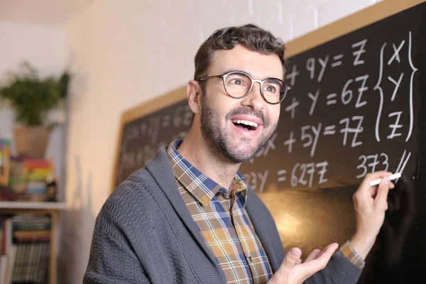 Close Portrait Handsome Young Teacher Writing Math Example Blackboard Classroom — Stock Photo, Image