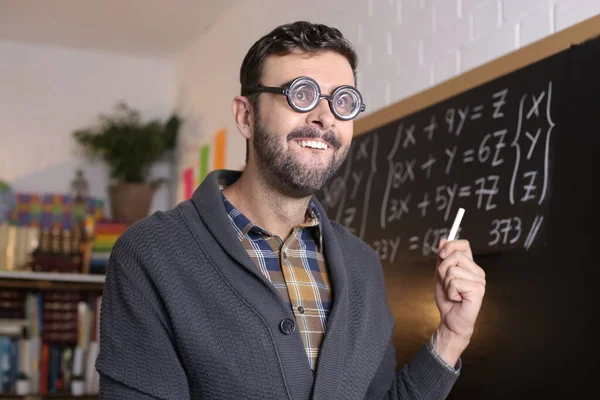 Close Portrait Handsome Young Teacher Funny Eyeglasses Holding Chalk Front — 图库照片