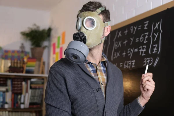 Close Portrait Teacher Gas Mask Holding Chalk Front Blackboard Classroom — Stock Photo, Image