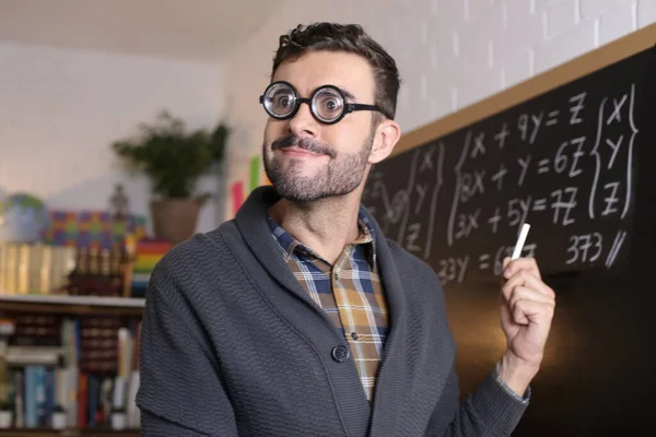 Close Portrait Handsome Young Teacher Funny Eyeglasses Holding Chalk Front — Zdjęcie stockowe