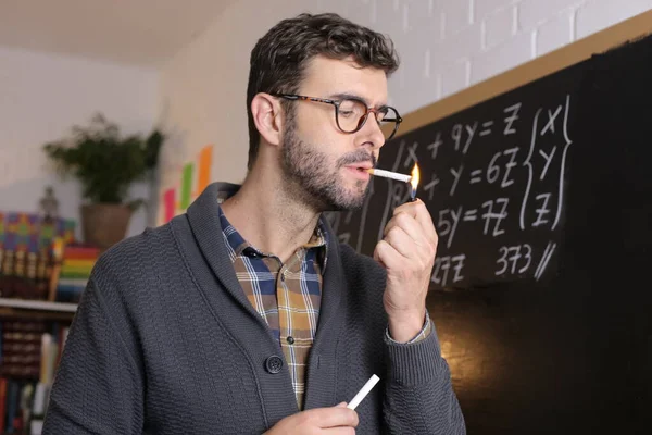 Close Portrait Handsome Young Teacher Holding Chalk Smoking Cigarette Front — Zdjęcie stockowe
