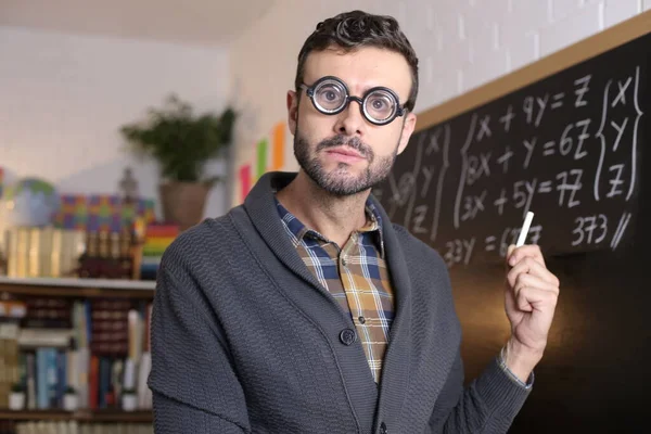 Close Portrait Handsome Young Teacher Funny Eyeglasses Holding Chalk Front — 图库照片