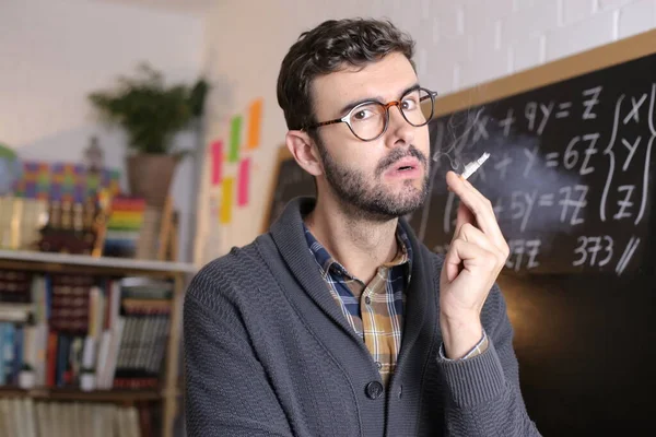 Close Portrait Handsome Young Teacher Holding Chalk Smoking Cigarette Front — Foto Stock