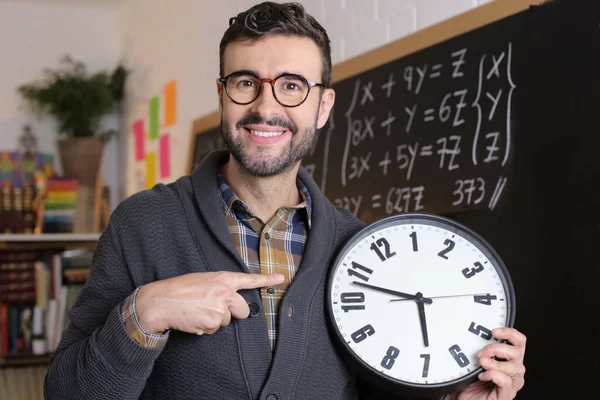 Close Portrait Handsome Young Teacher Holding Large Clock Front Blackboard — Stock Photo, Image