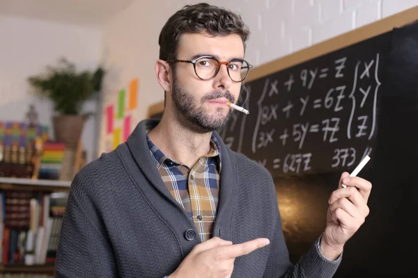 Close Portrait Handsome Young Teacher Holding Chalk Smoking Cigarette Front — Stock Photo, Image