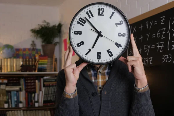 Close Portrait Teacher Holding Large Clock Front Face Front Blackboard — Stock Photo, Image