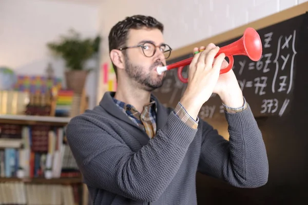 Close Portrait Handsome Young Teacher Playing Music Toy Horn Front — Foto de Stock