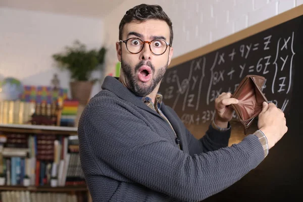 Close Portrait Shocked Young Teacher Holding Empty Wallet Front Blackboard —  Fotos de Stock