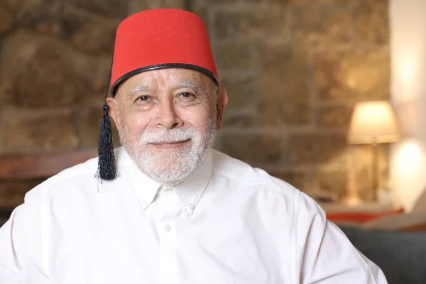 Close Portrait Handsome Senior Man Red Fez Hat Home — Stock Photo, Image