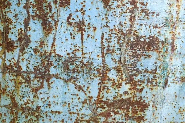 Old iron sheet with peeling brown paint and rusty spots. — Stock Photo, Image