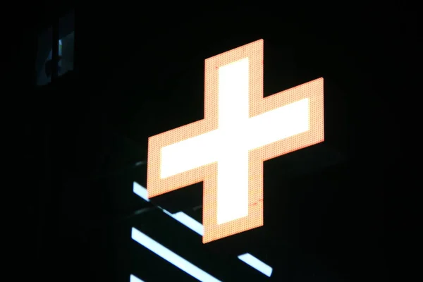 Glowing Pixel Cross Led Lamps Black Background Orange Cross White — Stock Photo, Image