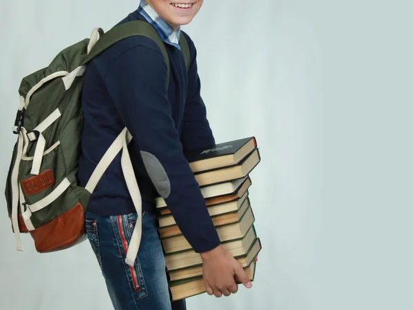 Man holding a stack of books — Stock Photo, Image