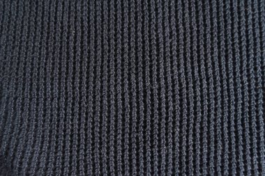 Siyah örülmüş süveter. Sıcak yün elbiseler. El yapımı. Soyut doku