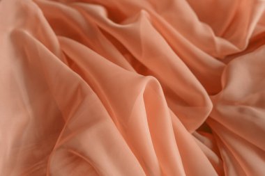 Pembe tül. Tekstil bir yumrunun içine kıvrılıp soyut bir kalıp oluşturuyor. Çok güzel, pastel renkler. Arkaplan olarak dokuyu kullan